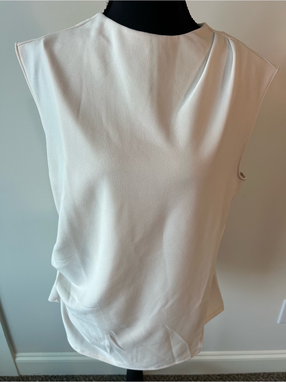MELLODAY Sleeveless Cream Draped Blouse with Side Pleats and faux wrap side